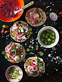 Texmex tortillas with red onions, jalapenos, coriander and fish