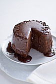 Steamed chocolate pudding with cocoa nibs and a chocolate-honey sauce