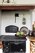 Wore basket of vegetables on old wood-fired stove