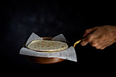Hands holding Mexican Tacos with fresh vegetables and chicken on dark background
