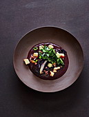 Red cabbage medley with cabbage sauce and an apple and bacon salad