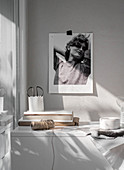 Black-and-white photograph above low sideboard
