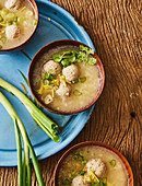 Thai rice soup with meatballs