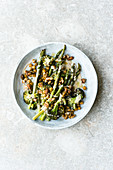 Oven-roasted Israeli vegetables with almonds, walnuts and a tahini sauce