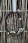 Wreath of birch twigs, wooden eggs and eucalyptus branches