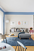 Blue living room with various grey seating