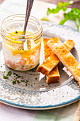 Coddled eggs with ham, cheese and toast soldiers (England)