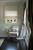 Armchair and side table in corner