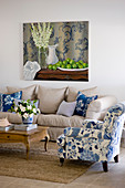 Blue-and-white armchair and ecru sofa in living room