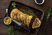 Sausage Strudel with caramelised onions, mixed herbs, mustard, poppy seeds and sundried tomatoes