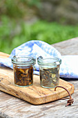 Essence of masterwort and teasels in preserving jars