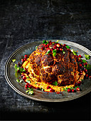 Whole roast cauliflower with warm harissa hummus