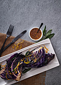 Roasted red cabbage wedges with wholegrain mustard and maple syrup dressing