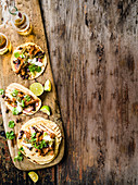 Beer-braised lamb tacos with charred green tomato salsa