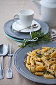 Penne with salmon and zucchini