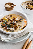 Mushrooms soup with kale and potatoes