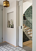 View through open sliding door into stairwell