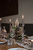 Arrangement of dried flowers on table set for wedding