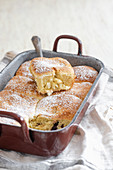 Vanilla buns in a baking pan