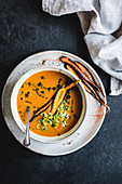 Carrot soup on a slate background