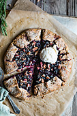 An autumnal galette with pears and blue grapes served with vanilla ice cream