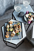 Fish and shrimp kebabs with brussels sprouts