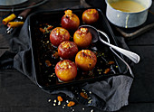 Mini baked apples in a baking dish