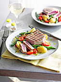 Chargrilled tuna with warm potato and bean salad