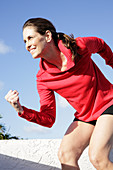 A woman working out on a terrace