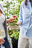 Peerson holding bowl of green olives