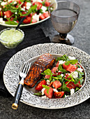 Grilled salmon, salad with feta cheese, mint and watermelon