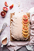 Poppy seed blood orange cake from a tin with icing