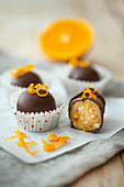 Homemade chocolates with marzipan-orange-nut filling