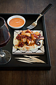 Galician-style braised octopus on mashed potatoes with pepper aioli