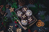 Iced and chocolate Elisenlebkuchen (Nuremberg gingerbread cake) in a tin