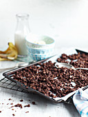 Chocolate granola on a baking tray