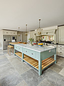 Cream country-house kitchen with huge light blue island counter