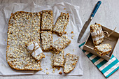 Homemade muesli bars from nuts and dried fruits with oats, milk in a glas