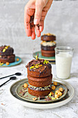 Baked muffins with chocolate and pistachios a glass of milk