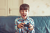 Young boy playing video game