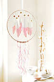 Handmade dream catcher with paper feathers