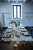 Place mats made from tree bark on festively set dining table