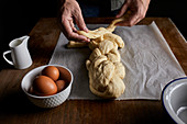 A braided loaf being made