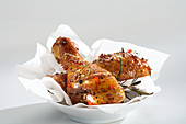 Spicy chicken drumsticks with pepper and chilli