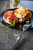 Filo pastry cake with caramelised figs, goat's ricotta and pine nuts