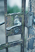 Artistic handle on old garden gate
