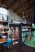 Shelves and wigwam in child's bedroom in loft apartment