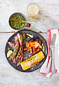 Bavette with chimichurri sauce, cheesy corn cobs and sweet potato mash