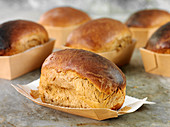 Mini breads in paper baking trays