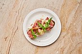 Open sandwich with ham and pear